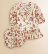 A sweet floral print adorns this girlie dress that comes with matching bloomers.Peter Pan collarLong sleeves with ruffled hemButton-frontDrop waistRuffled hemCottonMachine washImported Please note: Number of buttons may vary depending on size ordered. 