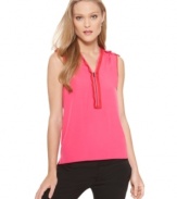 This petite top by T Tahari features delicate tiers of gently ruffled trim at the shoulders and at the exposed-zipper neckline. A sweet-meets-sassy look that easily transitions from day to night.