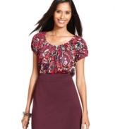 Style&co.'s boldly printed petite top will easily add a splash of color to your outfit.