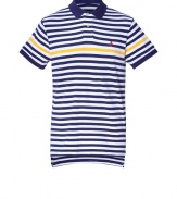 A warm-weather must-have, this polo shirt is created with classic American style in fine, blue and white striped cotton - Contrasting yellow stripe and small, red Ralph Lauren signature embroidered polo horse - Small collar, short button placket and slim fit - Traditional length with back slightly longer than front - Pair with jeans, chinos or shorts for an American preppy look