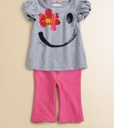 This shiny, happy set will brighten her day with a smiley face and flower graphic.CrewneckShort puff sleevesPullover styleElastic waistbandTee: CottonLeggings: 48% polyester/44% rayon/8% spandexMachine washImportedAdditional InformationKid's Apparel Size Guide 