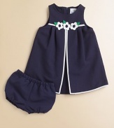 A flouncy frock with cheery flowers and matching bloomers will make your little girl look like a princess.Round necklineSleevelessBack zipperEmpire waist with floral waistband and back tieA-line silhouetteElastic waistband and leg openings65% polyester/35% cottonMachine washImported