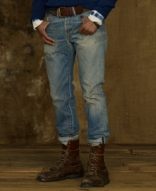 Signs of fading with rips and repairs lends a vintage workwear vibe to a pair of well-worn jeans in light-wash denim.