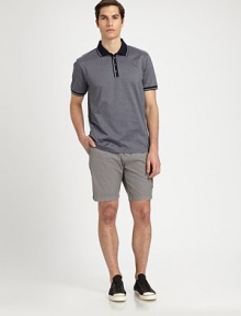 Regular-fitting, solid shorts are highlighted with slanted front, rear flap pockets and a side cargo pocket for a utilitarian feel, rendered in breathable, lightweight cotton for endless comfort.Flat-front styleSide slash, back flap pocketsFront coin, side cargo pocketInseam, about 9CottonDry cleanImported