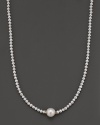 Fresh water pearl necklace with large center piece and 14 Kt. gold accent.