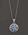 Sterling silver, jointed like a bamboo stalk, circles a glittering pavé lagoon of Swiss blue topaz and iolite gems on a pendant suspended from a delicate adjustable chain.