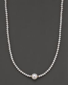 Fresh water pearl necklace with large center piece and 14 Kt. gold accent.