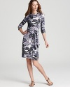 Shades of grey lend drama to an oversized floral print for a Tory Burch dress brimming with dark romance.