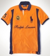 A custom-fitting rugby shirt celebrating the St. Moritz Polo World Cup on Snow receives a preppy feel with a scripted Ralph Lauren logo, bold color-blocking and Ralph Lauren's embroidered Big Pony.