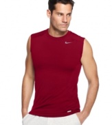 In motion. Stay going strong with this fitted sleeveless t-shirt from Nike featuring Dri-Fit technology.