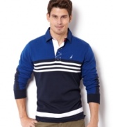 Stripes go sporty on this sharp color-blocked polo shirt from Nautica.