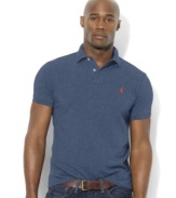 Designed in a relaxed classic fit with lower armholes, a wider body and a longer hem, this short-sleeved polo shirt is rendered in breathable cotton mesh for handsome style.