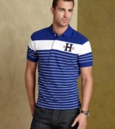 Bold stripes step up the classic design of this slim-fit Tommy Hilfiger polo shirt for standout style that can't be ignored.