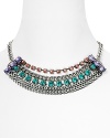 Make statement shine your signature with Aqua's chunky layered bib necklace. The gunmetal chain feels edgy, while multi colored crystal stations are a sweet, sparkly twist.