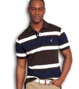 By land or by sea, this striped polo shirt from Nautica will keep you anchored in style.