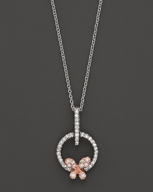 A dainty diamond butterfly pendant set in 14K. rose and white gold.