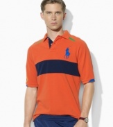 Rendered in breathable cotton mesh, Ralph Lauren's official limited edition US Open polo shirt embraces athletic style in sporty color-blocked design that's highlighted by a trim, modern fit.