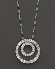 Circles of 14K white gold are a striking backdrop for glittering diamonds.