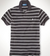 A classic-fitting short-sleeved polo shirt is crafted from breathable cotton mesh with a sleek striped pattern for casual polish.