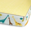 Brightly colored giraffes in blue, brown, orange and yellow parade among leafy trees on the side panels of the complete sheet. A mod, white hexagonal pattern on yellow is separated by tan piping.The American Academy of Pediatrics and the U.S. Consumer Product Safety Commission have made recommendations for safe bedding practices for babies. When putting infants under 12 months to sleep, remove pillows, quilts, comforters, and other soft items from the crib.