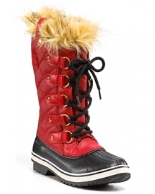 A bold, cozy burst of faux fur and chic, quilted canvas make winter's blasts a little less daunting. By Sorel.