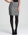 With a heightened hemline and slimming piping, this DKNY pencil skirt makes classic tweed look effortlessly cool.