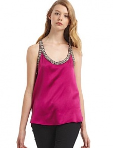 THE LOOKOrnately beaded edgesU necklineSleevelessRacerbackTHE FITAbout 26 from shoulder to hemTHE MATERIALSilkCARE & ORIGINDry cleanMade in USA of imported fabric