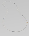 From the Caviar Collection. One extra long, ultra graceful chain of sterling silver, dotted with hammered beads of polished silver, blackened silver, and 24k yellow gold.Sterling silver and 24k yellow goldLength, about 50Spring clip claspImported