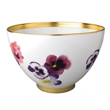 Pensees deep salad bowl by Bernardaud. This lively, luxurious collection is sure to transform your table into a celebration of spring. The floral watercolor pattern features delicate, multicolored pansies that appear to be strewn across the surface of each piece.