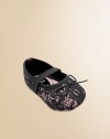 A pretty lace overlay with tiny bows and elastic straps across the instep.Polyurethane shoeRound toeElastic instep strapMicrofiber liningSoft polyurethane soleImportedAdditional InformationKid's Shoe Size Guide (European Equivalent) 