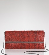 Evening style gets a touch exotic with this printed mesh clutch from BCBG Max Azria. In a bold hue, it's as striking as it is party-ready.