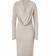 Perfect for taking from work into cocktails, Halston Heritages sleek beige dress is ideal for showcasing colorful accessories - Wrapped V-neckline with drape at waist, long sleeves - Form-fitting - Wear with a dusting of fine jewelry and sleek statement heels