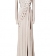 Elegance and modern style merge in this ultra-luxe jersey gown from celeb-favorite designer Elie Saab - Round-neckline, long sleeves, draped bodice, knotted waist detail, floor-length skirt, hidden back zip, side slit - Softly tailored fit - Pair with sky-high platform pumps and a jewel-encrusted clutch