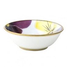 Pensees small sauce dish by Bernardaud. This lively, luxurious collection is sure to transform your table into a celebration of spring. The floral watercolor pattern features delicate, multicolored pansies that appear to be strewn across the surface of each piece.