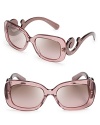 Go for Baroque in Prada's over-the-top sunglasses with statement-making arms.