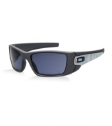 This clean, smooth, dark grey style is made of durable, yet lightweight O Matter®. The shape improves side protection, while Oakley's Three-Point Fit keeps the grey lenses in precise optical alignment. The lenses are cut from a single shield of optically pure Plutonite® to maintain the original, continuous contour of the frame. As part of the Team USA Collection, Fuel Cell carries icons with a patriotic red, white and blue combination in vertical bands of color. The side of the frame has a unique work of art, a design that shows the partial USA letters from a distance. A closer look reveals the Latin words Citius Altius Fortius in multiple lines with an interlaced translation Faster Higher Stronger which is the Olympic motto.