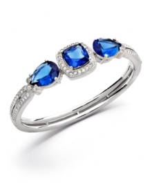 Brilliance in bold, blue hues! Eliot Danori's standout bangle style highlights square and pear-cut blue glass encircled by clear crystal accents. Crafted in silver tone mixed metal. Approximate diameter: 2-1/2 inches.