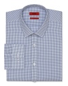 An extra slim-fit HUGO dress shirt touts a plaid pattern and traditional barrel cuffs for streamlined office polish.