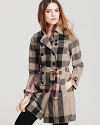 A classic Burberry trench gets an update in a lightweight cotton-linen, splashed in the brand's signature check print.