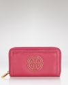 Soft and sumptuous, Tory Burch's zip around continental wallet features practical flourishes with a Park Avenue flair.