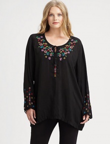 Beautifully woven and featuring exquisite embroidery, a tunic offering a relaxed fit that will work wonderfully with slim-fitting pants.Self-tie detail at embroidered necklineLong sleevesPull-on styleAbout 34 from shoulder to hemRayonMachine washImported