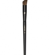 This round angled, natural-bristled brush is the ideal partner to all eye shadows. Its rounded countoured edges perfectly apply shadow to the crease and corners of the eye. How to use:Dip the angled side of the brush into eye shadow. Tap off excess. To contour, apply with the angled side horizontally into the crease with the longer side facing out. For a more dramatic contour, apply with longer end downwards into the crease. To contour the outer corners, sweep the angled side downward from the outermost area of the crease, toward the lashes.Backstage Beauty Tip: Rotate the brush upside down so the flat edge is facing up and apply color to the crease using a back and forth motion. Rounded contoured edges provide perfect application to crease and corners of the eye.