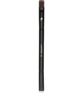 This versatile dual-ended brush is the ideal partner to eye shadows, both powder (wet or dry) and cream shadows. Designed with two sides for portability and convenience: the flat, angled side precisely lines the lid and lower lash line, while the tapered, rounded side perfectly blends. Angled side cut at sharper angle for better lining and use in the brow. How to use: Apply shadow to back of hand to warm and remove excess. To shape, shade or highlight place the rounded side of the brush upside down into the lash line and blend upward toward the crease for even application. To define and line gently sketch the flat, angled side of the brush through the lash line to achieve desired look.