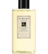 Inspired by a sun drenched morning in an English garden, White Jasmine & Mint captures the scent of jasmine, wild rose and white blossoms with an unexpected twist of wild mint. White Jasmine & Mint Bath Oil gently fragrances and moisturises the skin. Lush and softly foaming, it's pure relaxation. 8.5 oz. 