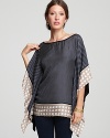 This Bailey 44 top boasts a graceful caftan-like silhouette and contrasting border for an eye-catching juxtaposition.