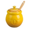 So sweet. Embellished with a honey bee, this stoneware pot exudes charm. A matching dipper with an easy-to-clean silicone head rounds out the set.