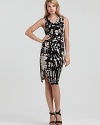 A draped neck and notice-me abstract print make a party-perfect anecdote for this Nola Z dress.