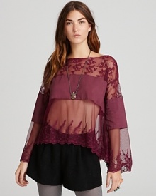 This sheer Free People lace top boasts a wide neckline and bell sleeves--an essential layering piece for new-season bohemia.