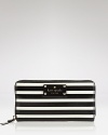 Statement stripes prove practical with this zip around leather wallet from kate spade new york. With space for your cash, card and coins, it's a graphic way to stay organized.