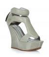 The certifiable must-have shoes of the season, these fashion-forward Camilla Skovgaard wedges are statement-making - Peep-toe, front panel with cut out detailing, ultra-high wedge heel, back zip closure - Pair with printed jeans and a blazer or an eye-catching cocktail frock